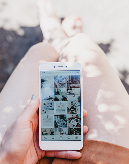 Social Media Management: Bird's eye view of iphone in person's lap
